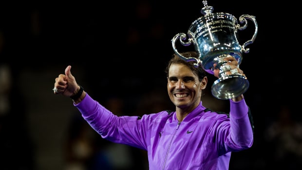 rafa_holds_up_2019_us_open_trophy.jpg